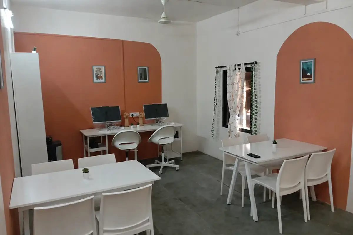 The Vihirgaon library after renewal, with reading tables, computers and terracotta wall details